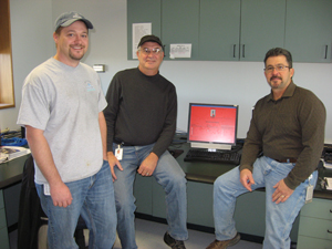 Bill Carr, John Alligood and Buddy Franklin with the EnerNOC computer program