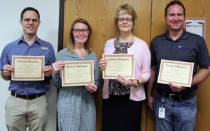 The Innovations Team presented the Innovations Award to staff members from the Library and Communications for the Summer Readers Bonanza. Pictured: Chris Sauder, Kristin Brown, Linda Sappenfield and Brian Ligon. 