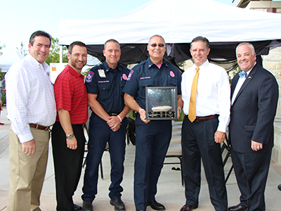 At the 2014 Customer Service Awareness Day, the Innovations Team presented the Rock Award to the Fire Department for its Computer Aide Dispatch System. This system automatically notifies command staff of any rescue or emergency, allowing personnel to focus on the scene rather than alerting others. From left: Councilmembers Moman and Morgan, Shane Glaiser, David Coatney, Mayor McGraw, and Councilmember Peckham.